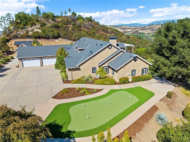 birds eye view of property with a mountain view