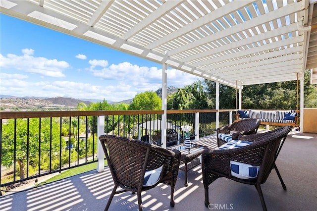 exterior space with a mountain view and a pergola