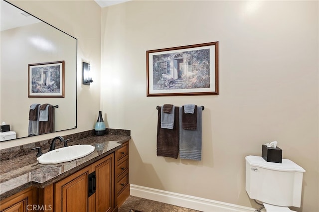 bathroom featuring vanity, toilet, and tile patterned floors