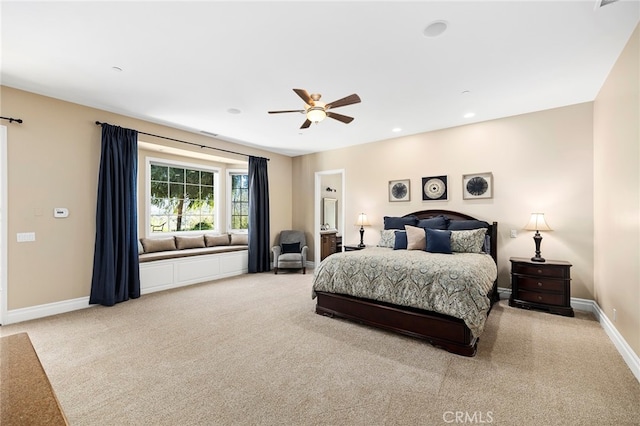 bedroom with light carpet and ceiling fan