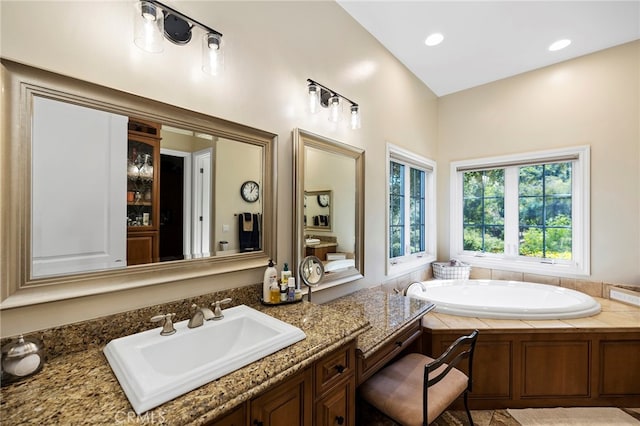 bathroom with vanity and a bathing tub