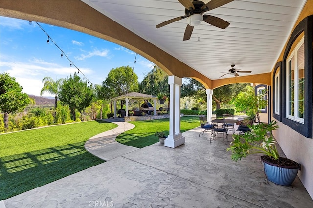 view of patio / terrace with a gazebo and ceiling fan