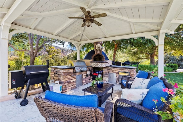 view of patio with area for grilling, a gazebo, and ceiling fan