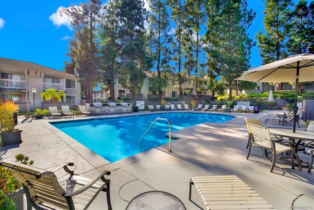 view of swimming pool with a patio area