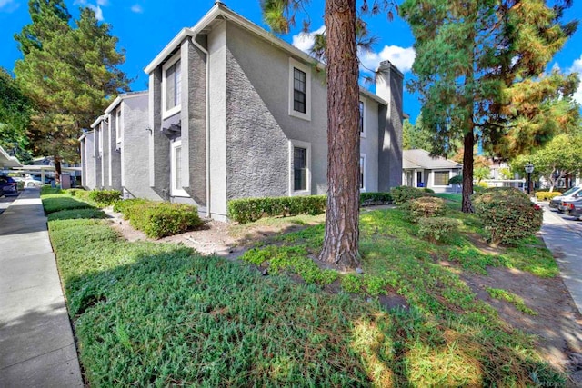 view of property exterior featuring a yard