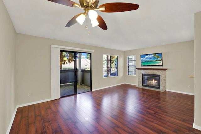 unfurnished living room with ceiling fan and hardwood / wood-style floors