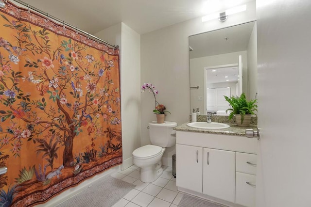 bathroom featuring toilet, tile patterned flooring, and vanity