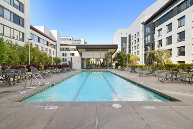 view of swimming pool with a patio