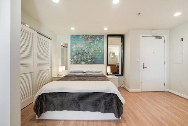 bedroom with light wood-type flooring