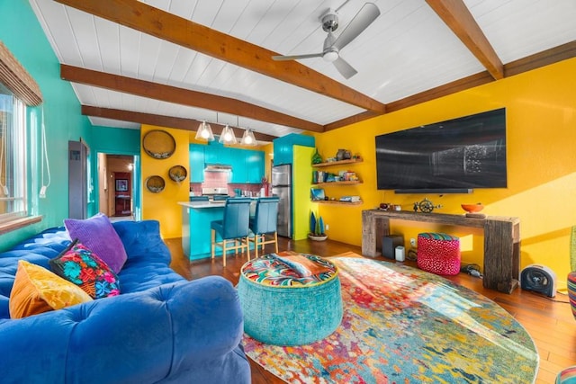 living room with beam ceiling, hardwood / wood-style flooring, and ceiling fan