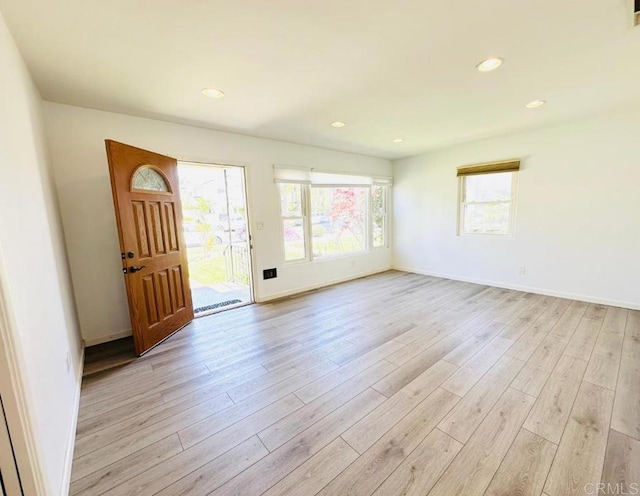 foyer entrance with light hardwood / wood-style flooring