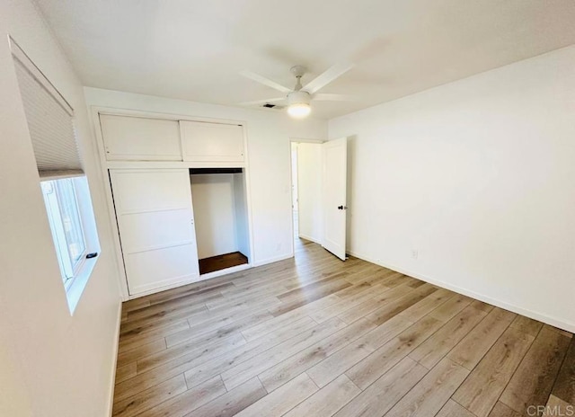 unfurnished bedroom featuring a closet, ceiling fan, and light hardwood / wood-style floors