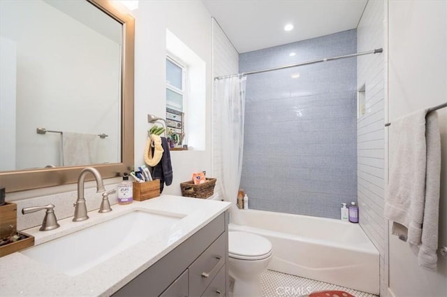 bathroom with shower / bath combo, vanity, and toilet