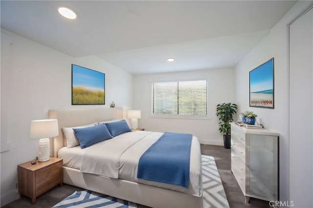 bedroom with recessed lighting, baseboards, and wood finished floors