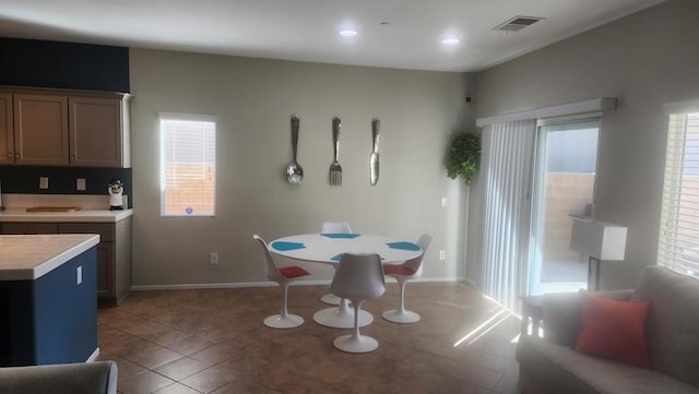 dining space featuring tile patterned flooring