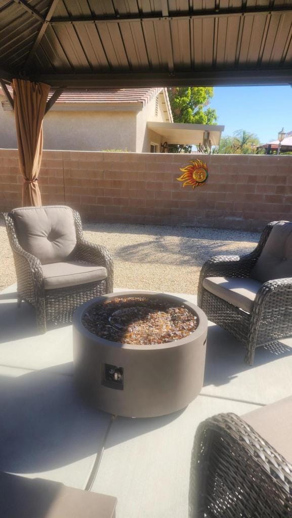 view of patio / terrace featuring a fire pit