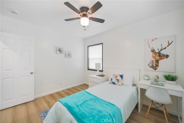 bedroom with light wood-type flooring and ceiling fan