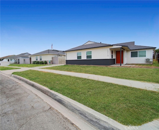 ranch-style house with a front lawn