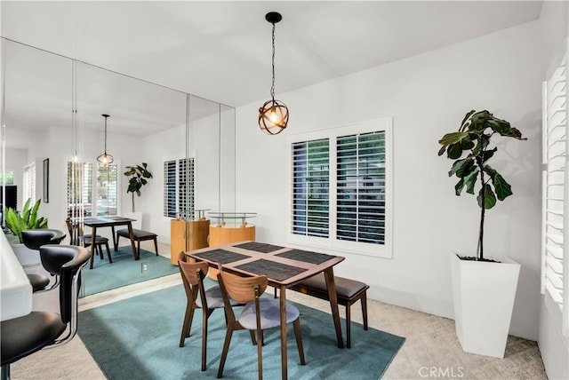 view of carpeted dining space