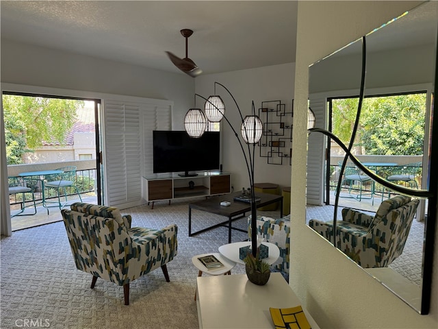 living room with light carpet and plenty of natural light