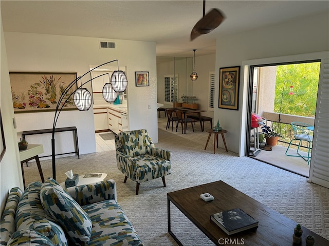 living room featuring light colored carpet