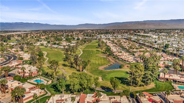 birds eye view of property with a mountain view