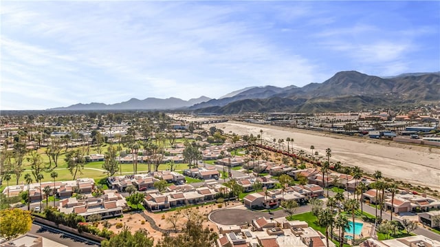 birds eye view of property featuring a mountain view