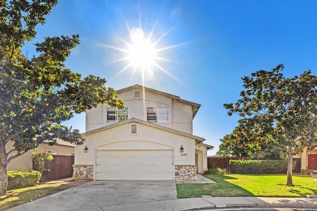 view of front facade featuring a front lawn and a garage