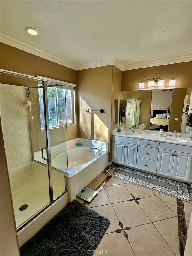 bathroom with tile patterned floors, crown molding, vanity, and independent shower and bath