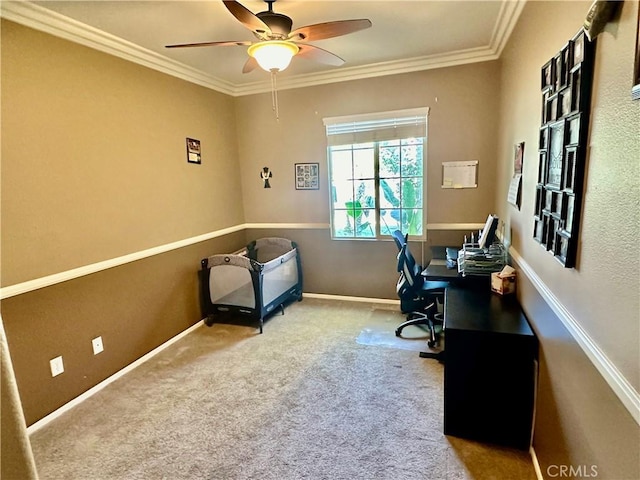 office space featuring ceiling fan, ornamental molding, and light carpet