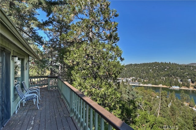 wooden terrace with a water view