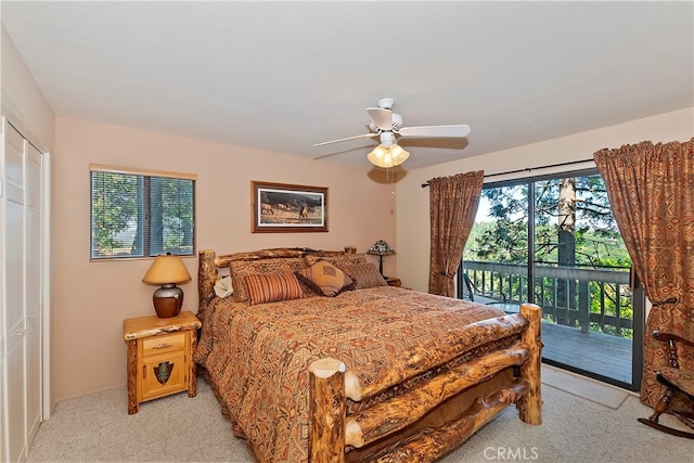 bedroom with a closet, ceiling fan, light colored carpet, and access to exterior