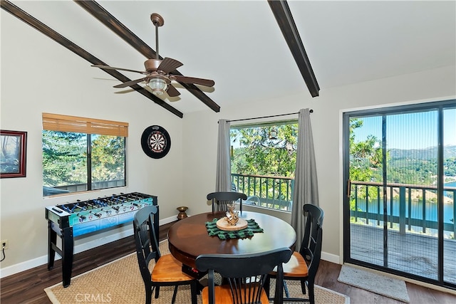 dining space with vaulted ceiling with beams, wood-type flooring, and ceiling fan