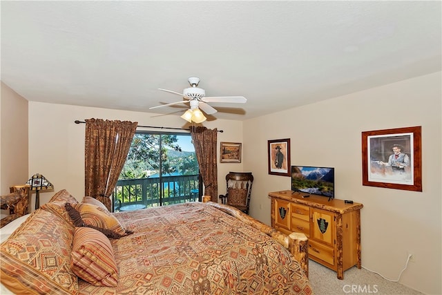 carpeted bedroom featuring access to exterior and ceiling fan