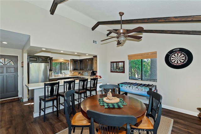 dining space featuring vaulted ceiling with beams, dark hardwood / wood-style floors, and ceiling fan