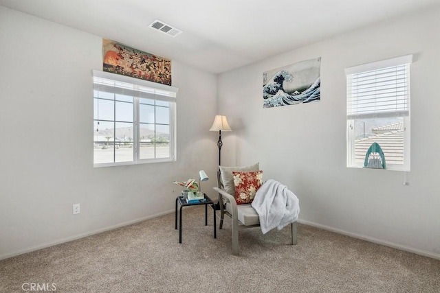 living area with carpet flooring