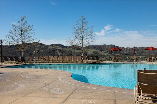 view of swimming pool featuring a mountain view