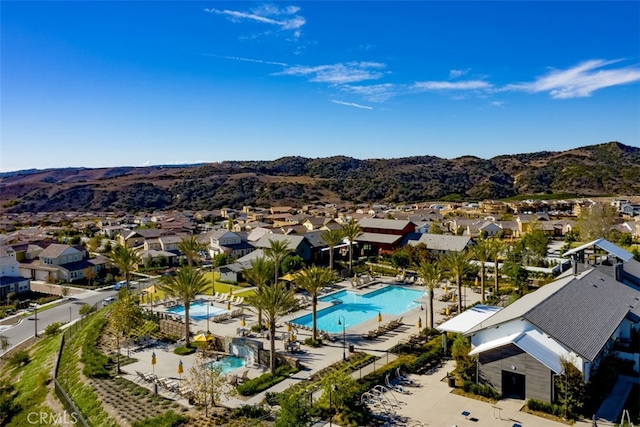 birds eye view of property featuring a mountain view