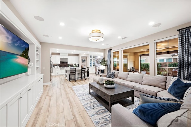 living room featuring light wood-type flooring