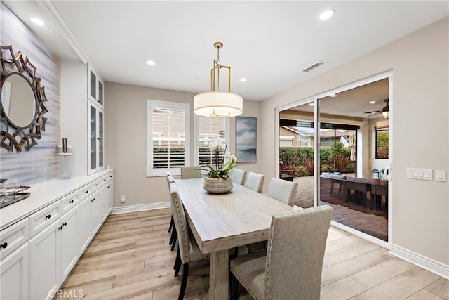 dining space with light wood-type flooring