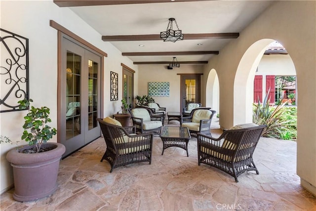 view of patio featuring an outdoor hangout area, ceiling fan, and french doors