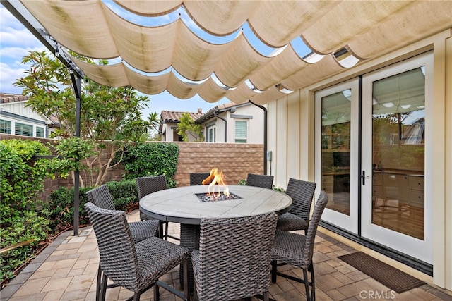 view of patio / terrace with an outdoor fire pit