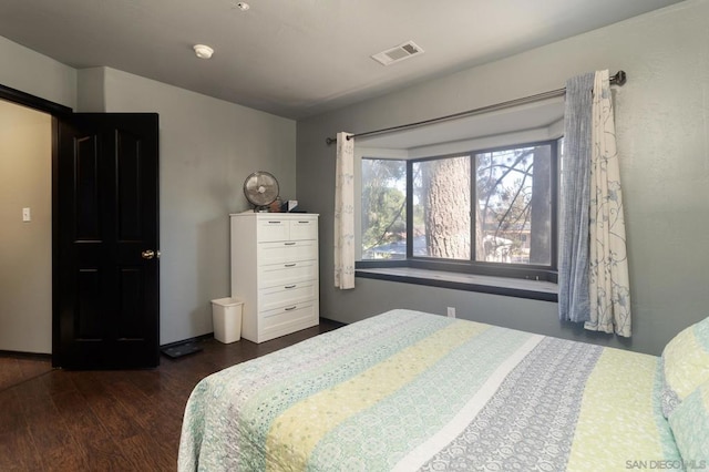 bedroom featuring dark wood-type flooring