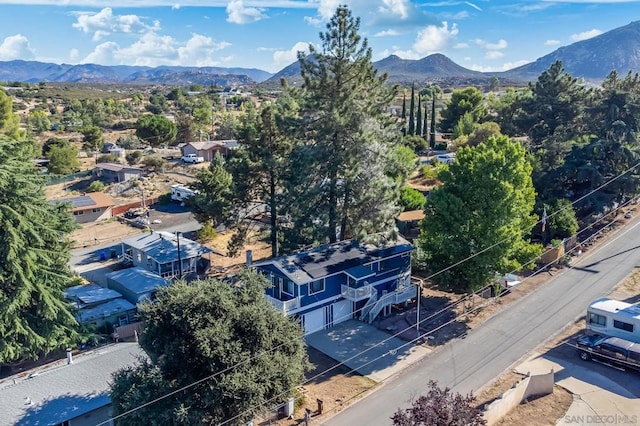 birds eye view of property featuring a mountain view