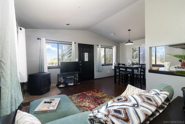 living room featuring lofted ceiling and wood-type flooring