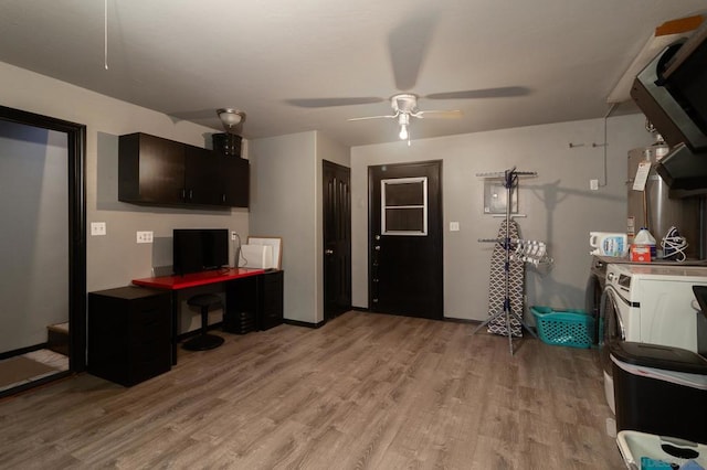 office space with independent washer and dryer, light hardwood / wood-style floors, and ceiling fan