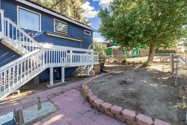 exterior space with a patio and a deck