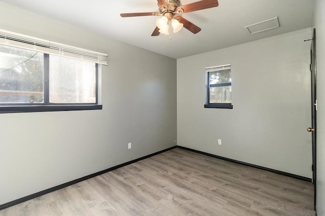 unfurnished room featuring light hardwood / wood-style floors and ceiling fan