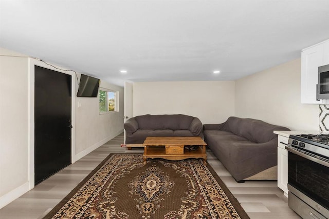 living room with light hardwood / wood-style flooring