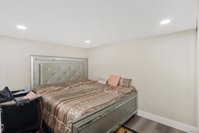 bedroom with wood-type flooring